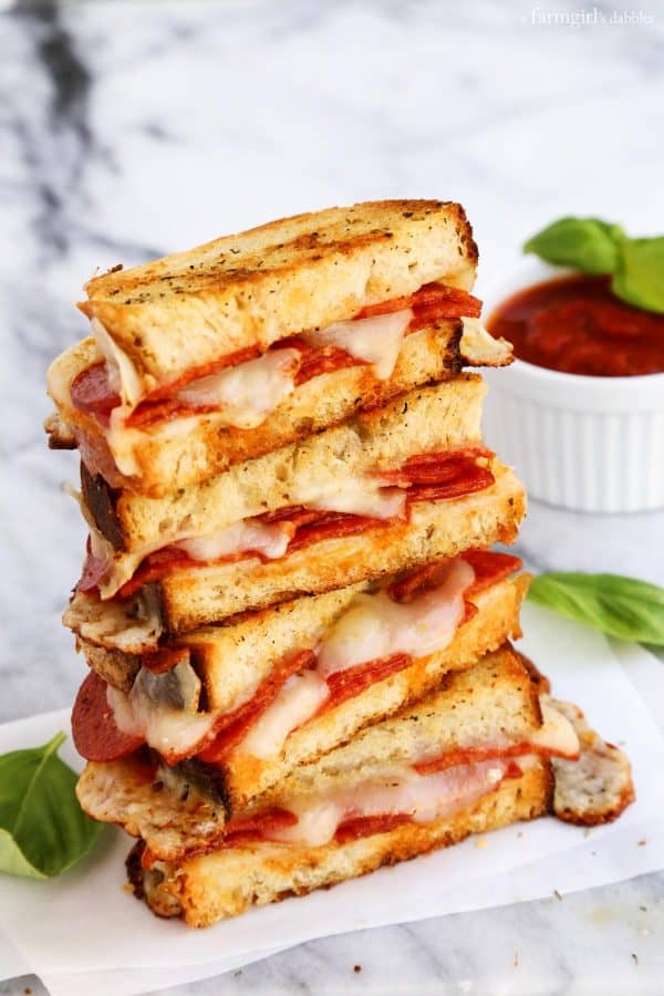 Pepperoni Pizza Grilled Cheese stacked on top of each other