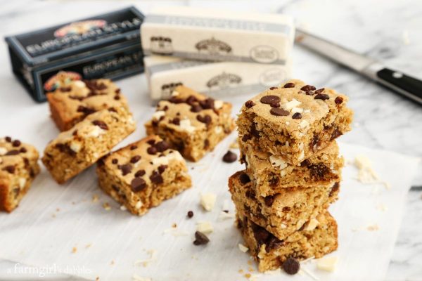sliced Triple Chocolate Coconut Blondies stacked on top of each other