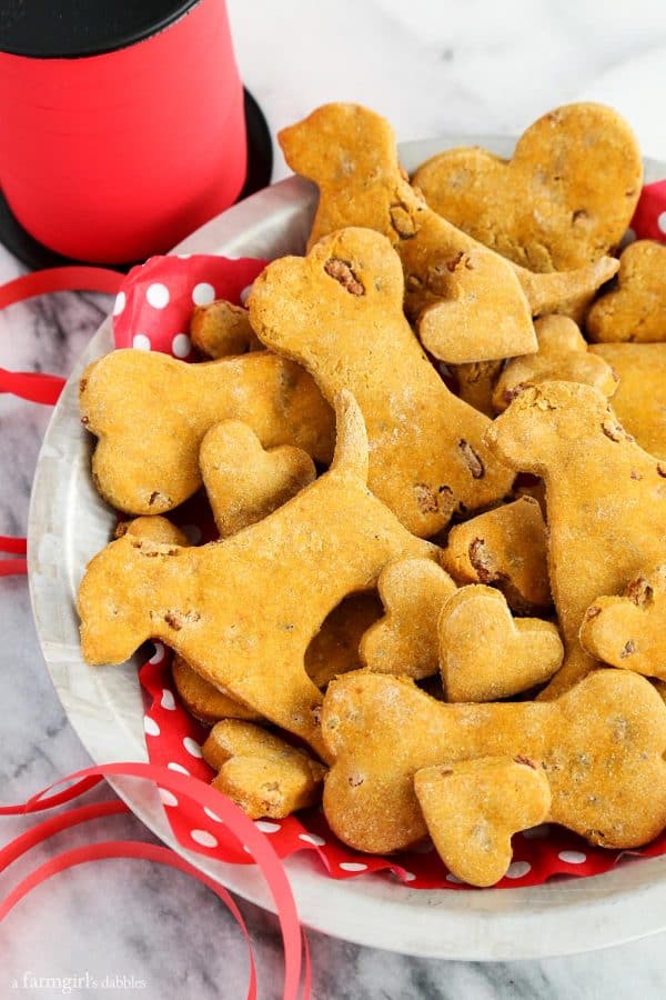 Homemade Pumpkin Bacon Dog Treats with red ribbon