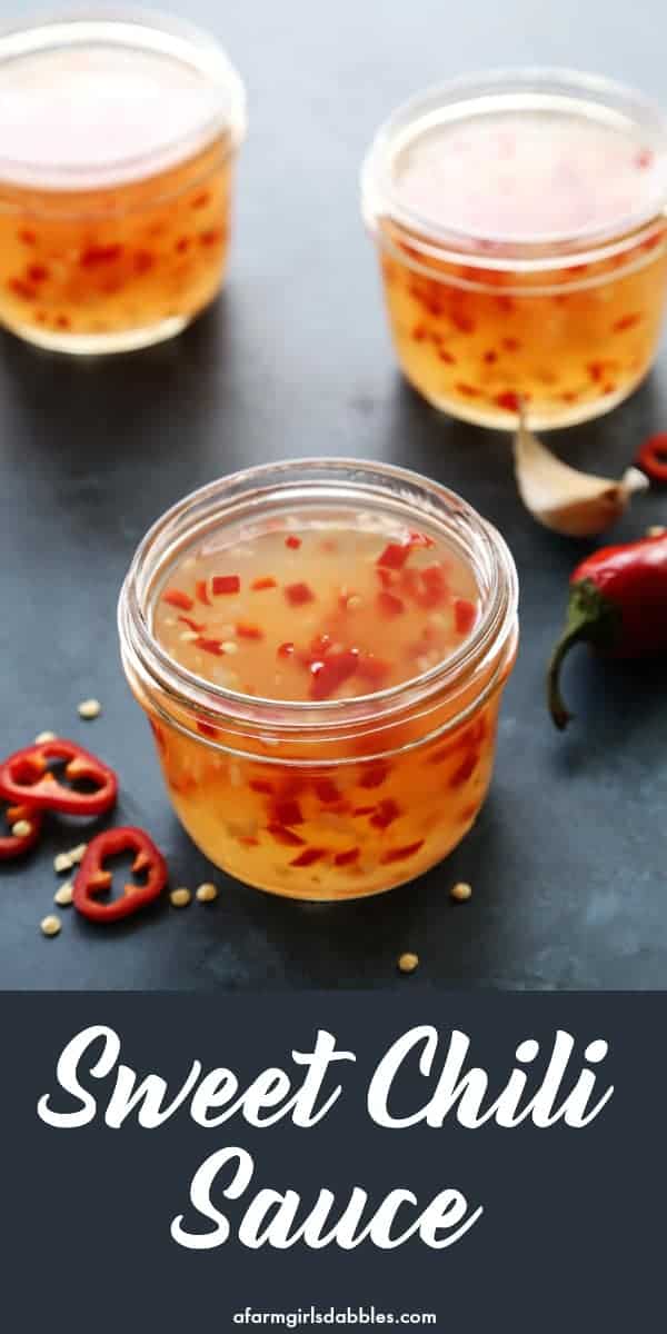 three jars of sweet chili sauce, plus red chili peppers and garlic
