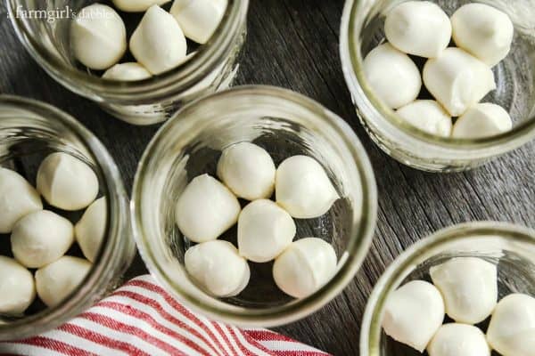 balls of mozzarella in mason jars