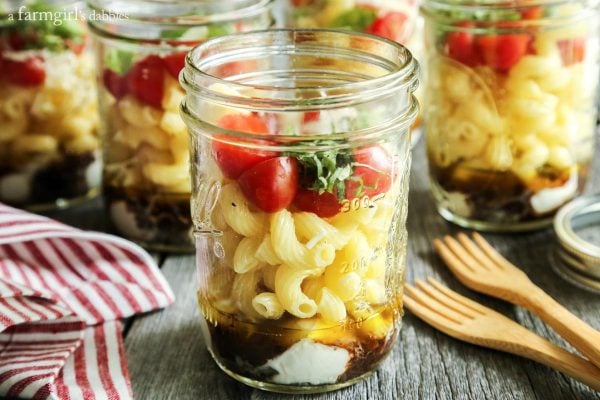 Individual Caprese Pasta Salads with wooden forks