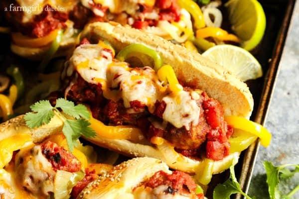 Cheesy Taco Meatball Subs on a pan