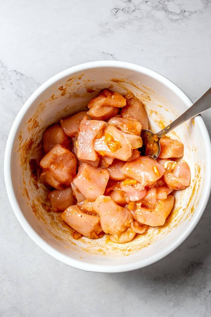 Overhead view of turkey in bowl of marinade