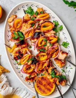 Overhead view of grilled chipotle orange turkey kabobs on platter