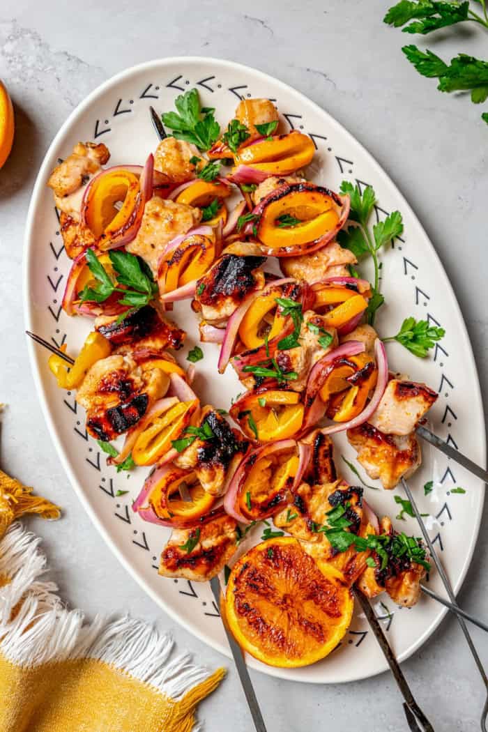 Overhead view of grilled chipotle orange turkey kabobs on platter