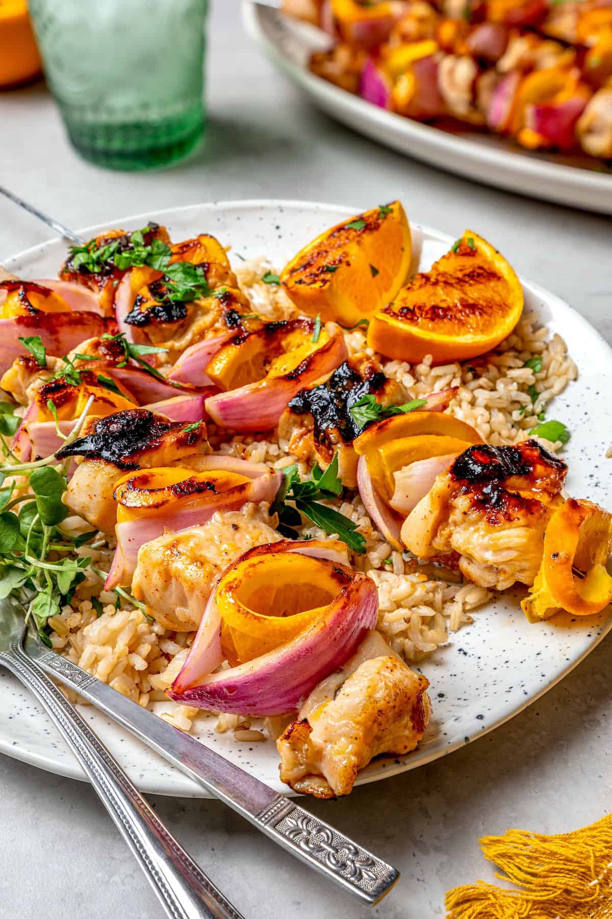 Plate of grilled chipotle orange turkey kabobs with rice