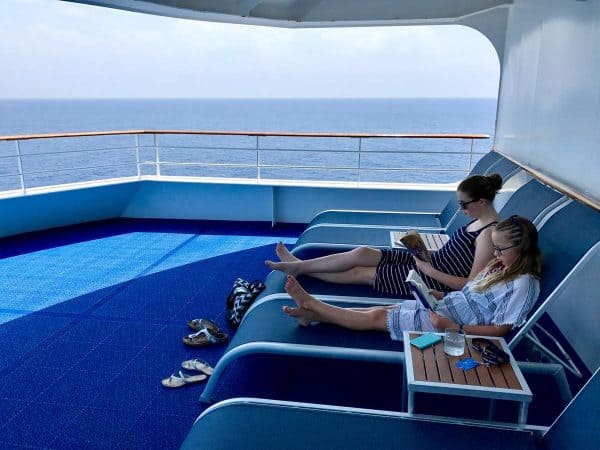 reading on the ship deck