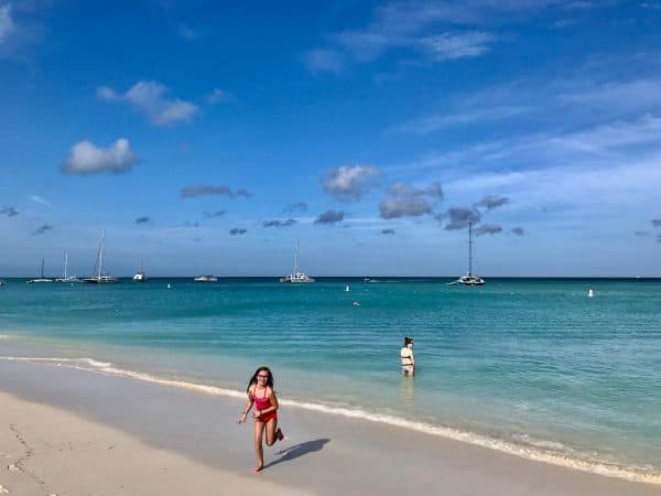 two girls on a beach in aruba