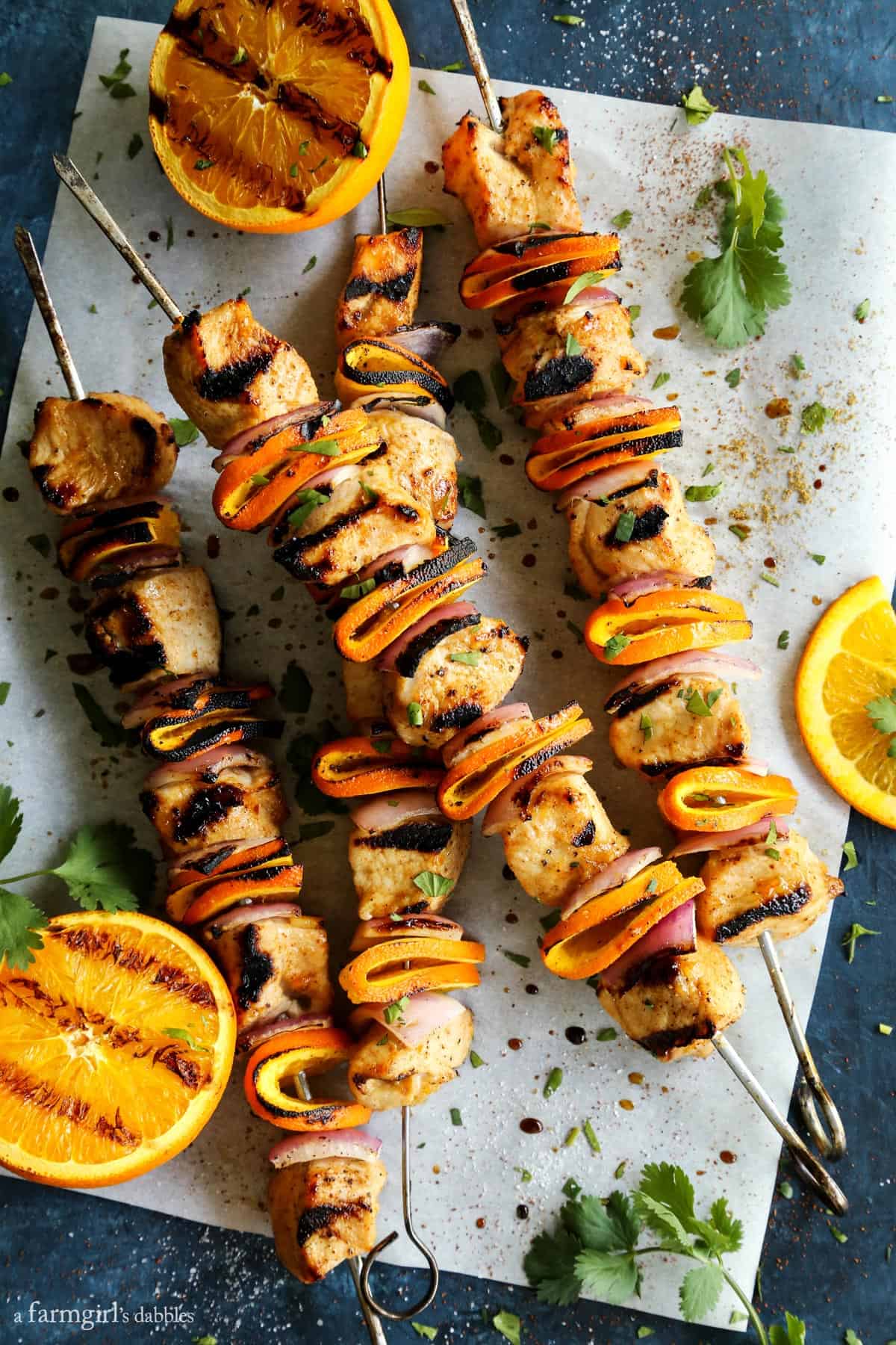 Grilled Chipotle Orange Turkey Kebabs on parchment paper