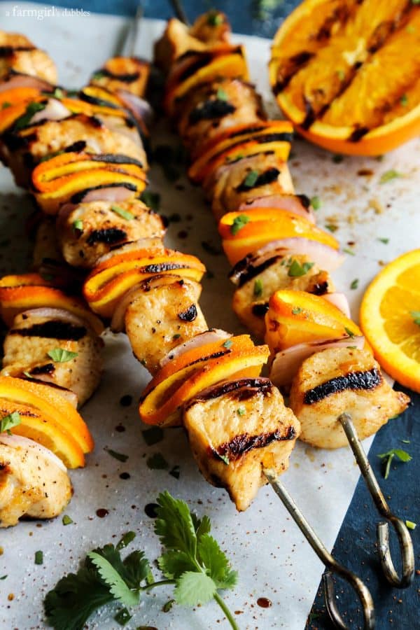 Grilled Chipotle Orange Turkey Kebabs with fresh cilantro and orange slices