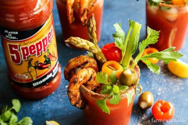 three glasses of 5 Pepper Bloody Mary with Grilled Jalapeño Shrimp