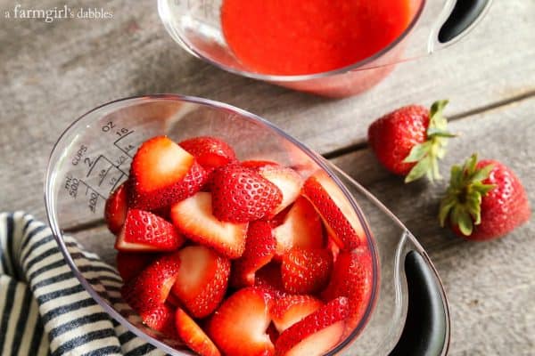 strawberries in a measuring cup