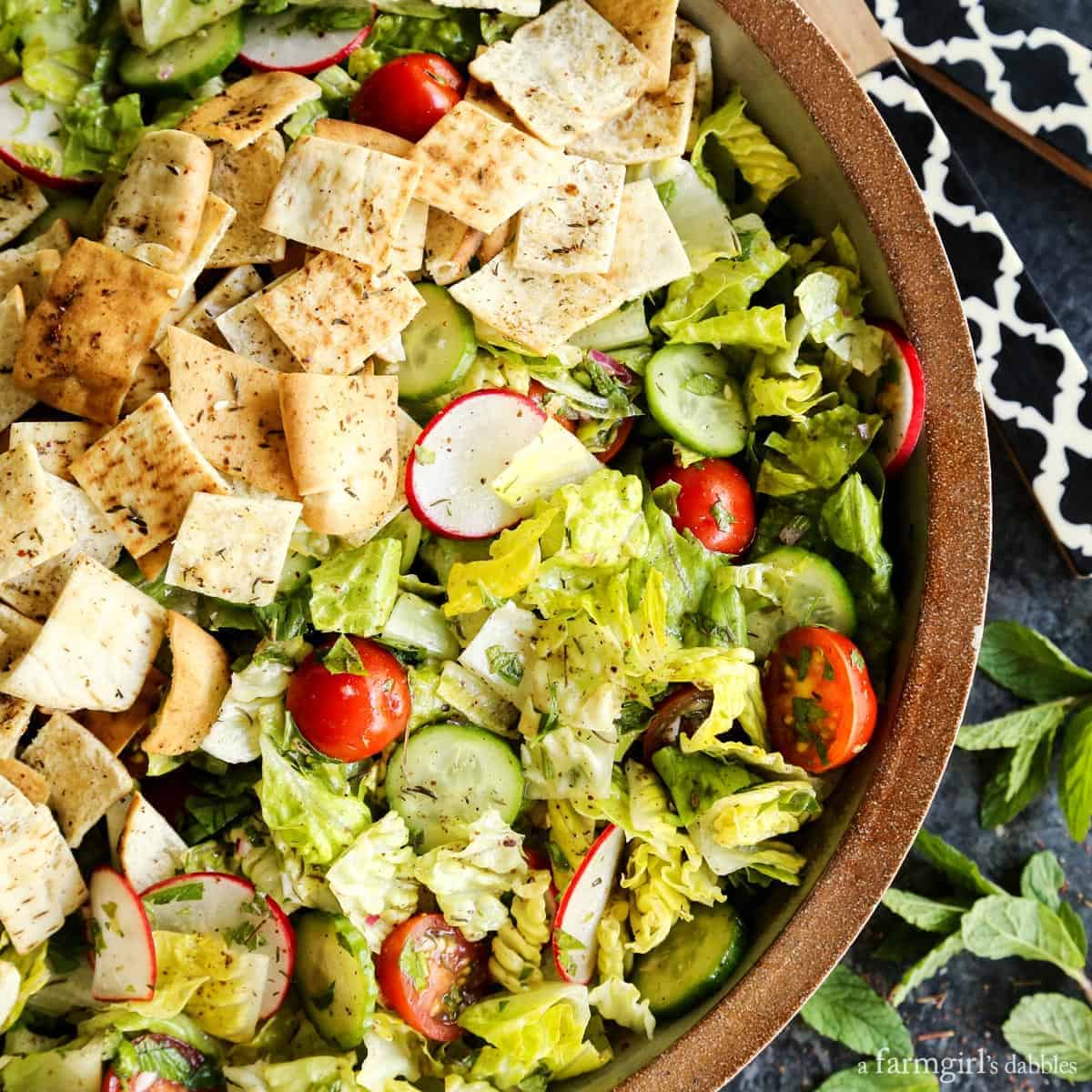 Overhead view of fattoush salad in a pottery bowl