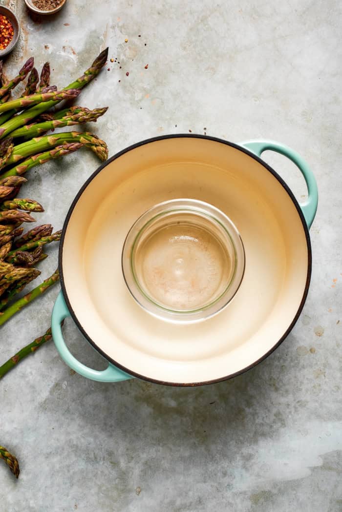 Jar in pot of water.