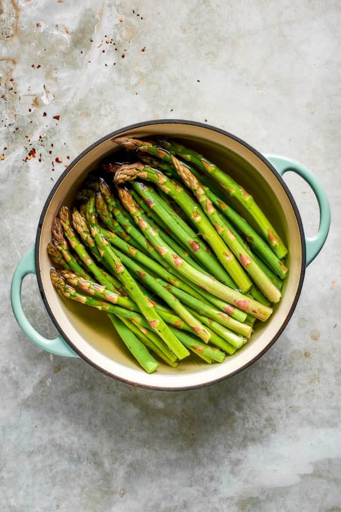 Asparagus blanching in pot of water.