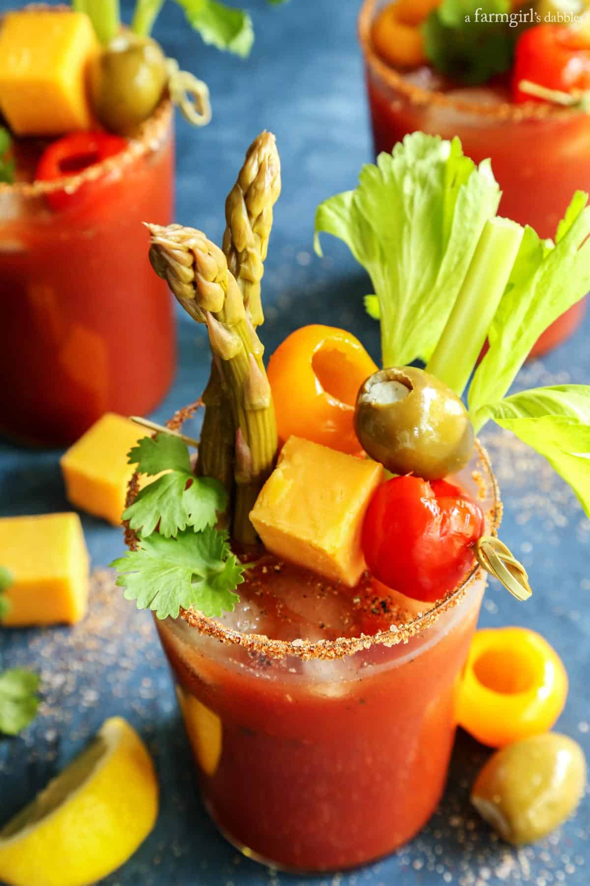 Three glasses of Bloody Mary cocktail.