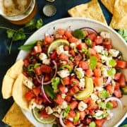 A bowl of watermelon ceviche with chips