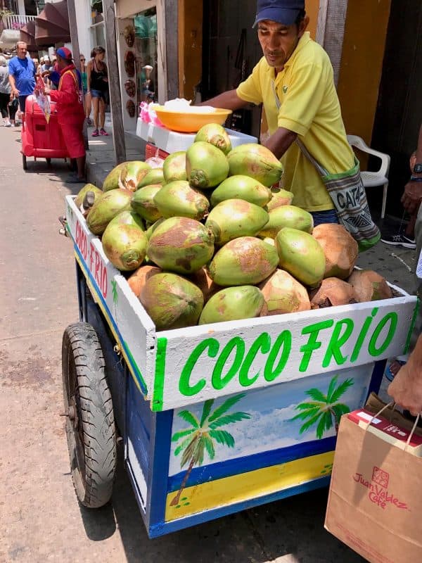 a man selling coconuts in Cartagena, Colombia