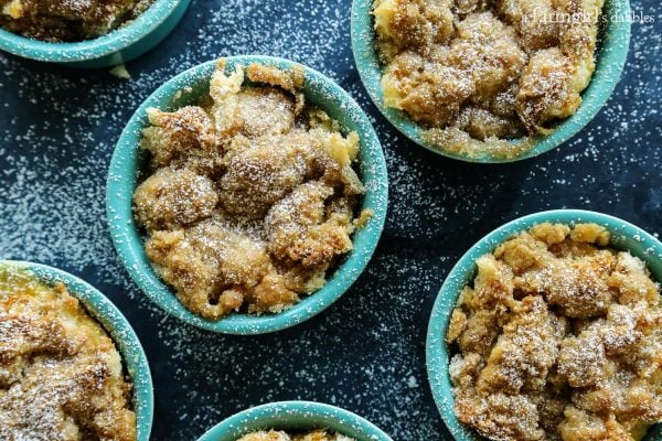 Cinnamon Streusel Apple French Toast Cups with powdered sugar