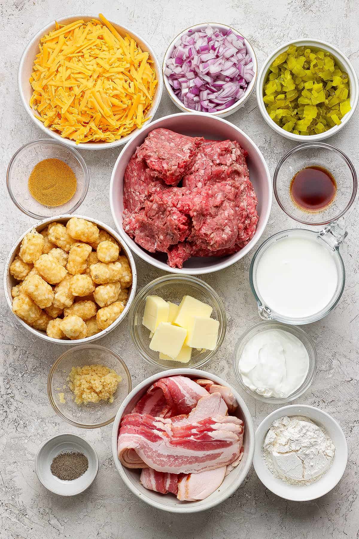 Ingredients for bacon cheeseburger tater tot casserole.