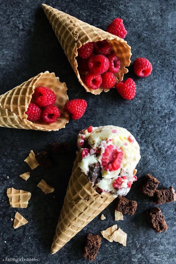 Fresh Raspberry and Brownie Chunk Ice Cream and raspberries in and ice cream cone