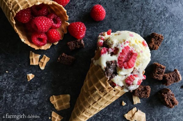 Fresh Raspberry and Brownie Chunk Ice Cream in a waffle cone