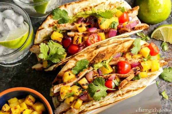 Grilled Pork and Pineapple Tacos on a taco stand