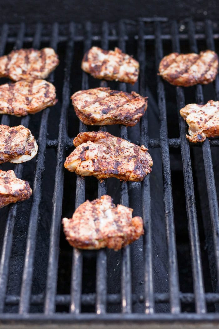 Sliced pork tenderloin on grill