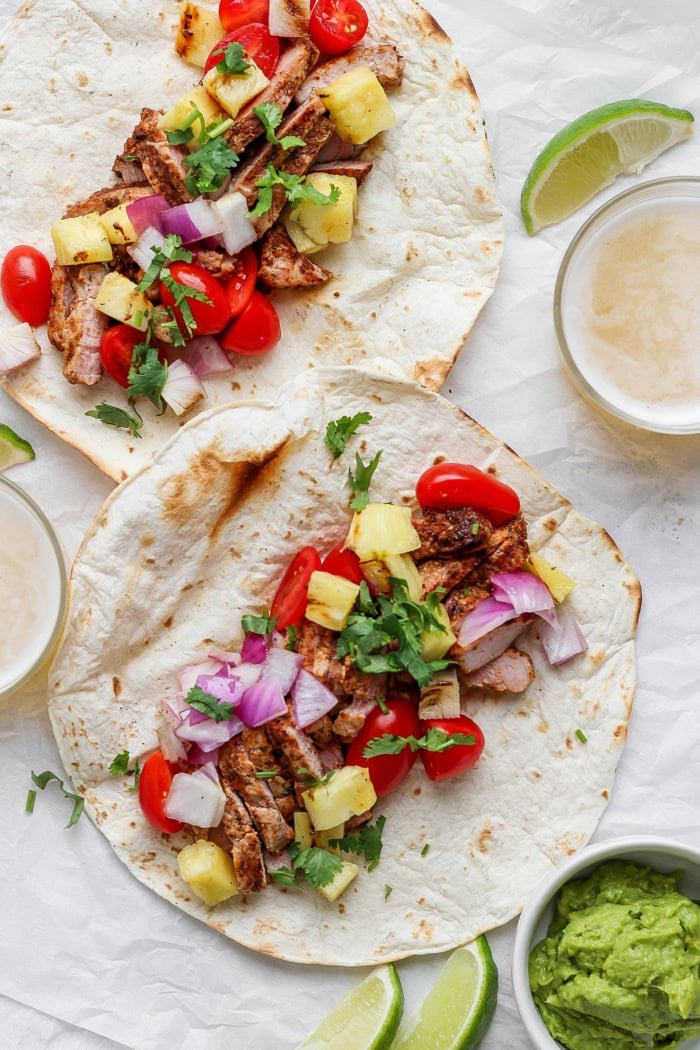 Two pulled pork and pineapple tacos before folding
