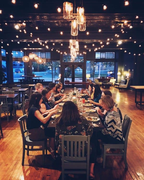 people eating at a long table