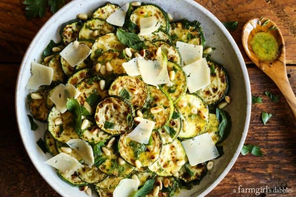 Grilled Zucchini Salad with Lemon-Herb Vinaigrette with a wood serving spoon