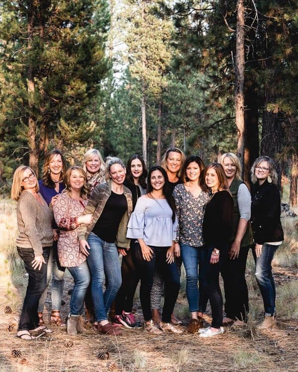 a group of women in a forest