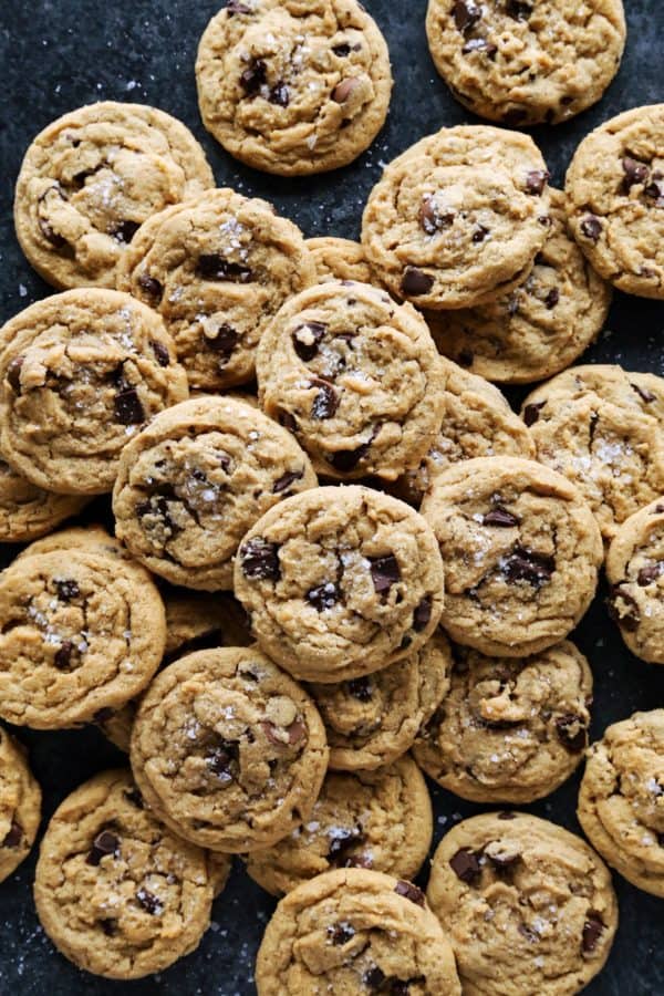 a pile of peanut butter chocolate chip cookies on the counter