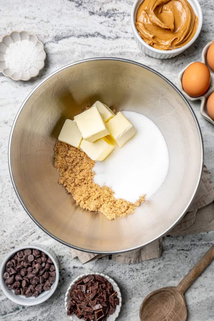 White sugar, brown sugar, and butter in mixing bowl.