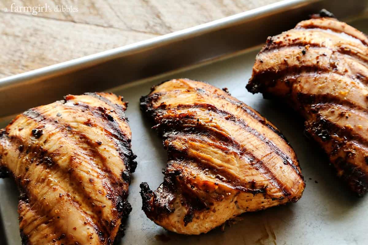 grilled turkey tenderloins on a rimmed sheet pan