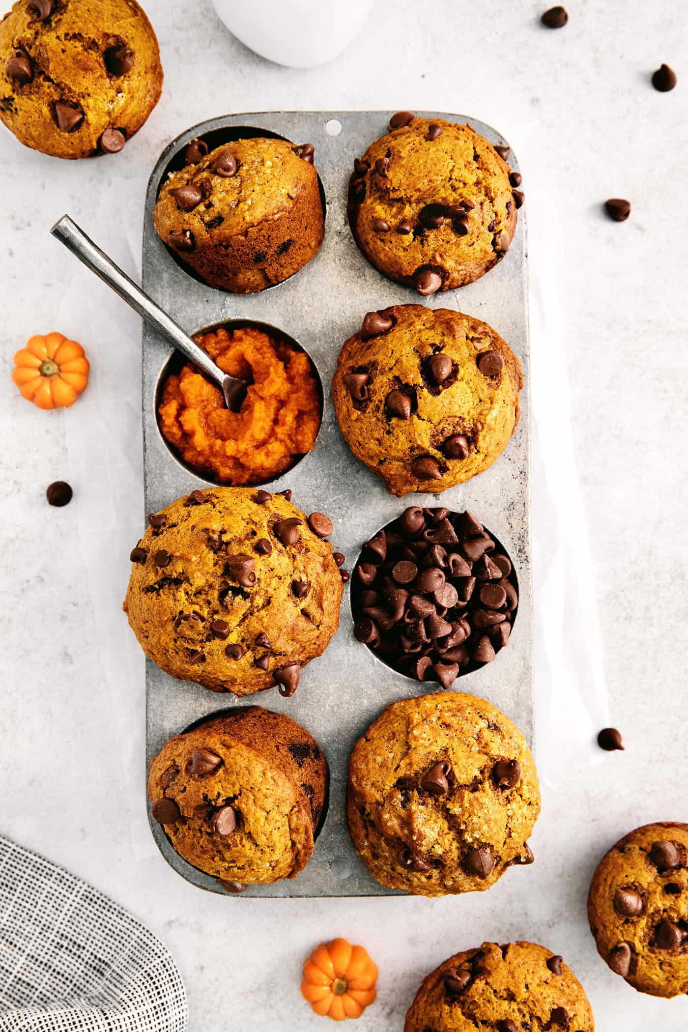 Overhead view of pumpkin muffins in a muffin pan