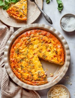Crustless quiche fresh out of the oven in the pie plate.