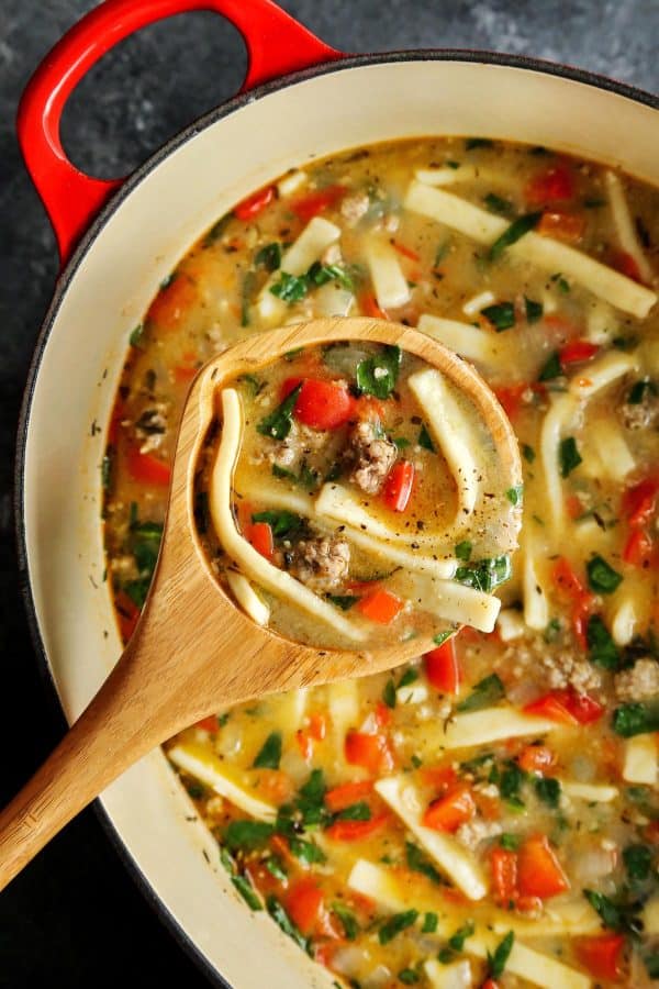 Sausage and Red Pepper Soup with Egg Noodles in a red pot