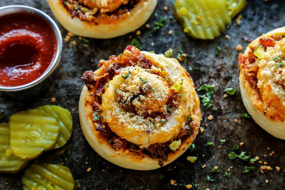 Bacon Cheeseburger Pizza Rolls with ketchup and pickles