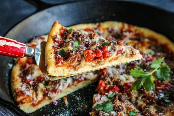 a slice of Skillet Pizza with Sausage and Chili Garlic Tomato Sauce