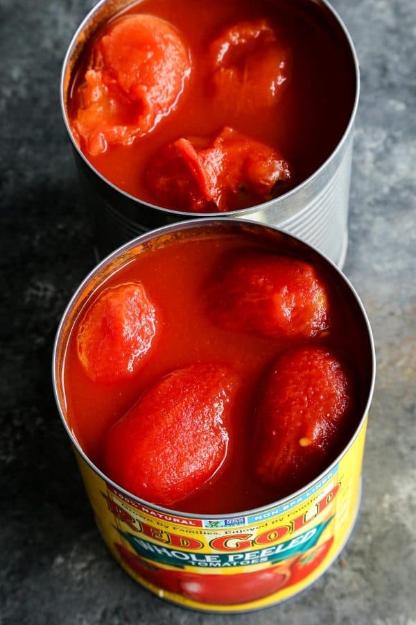 two open cans of Red Gold Tomatoes