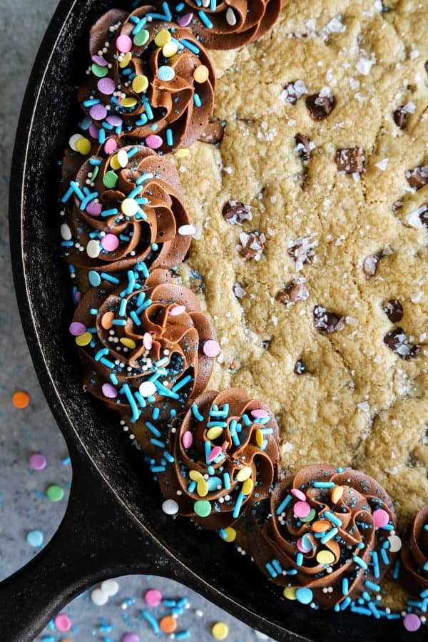 Brown Butter Chocolate Chip Skillet Cookie with sprinkles and frosting