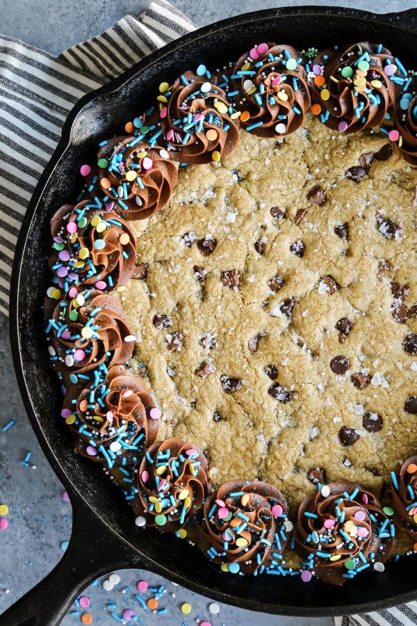 Brown Butter Chocolate Chip Skillet Cookie with chocolate frosting