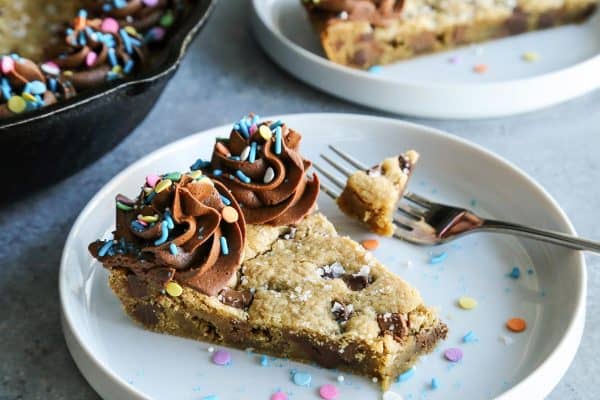 a bite taken out of the Brown Butter Chocolate Chip Skillet Cookie