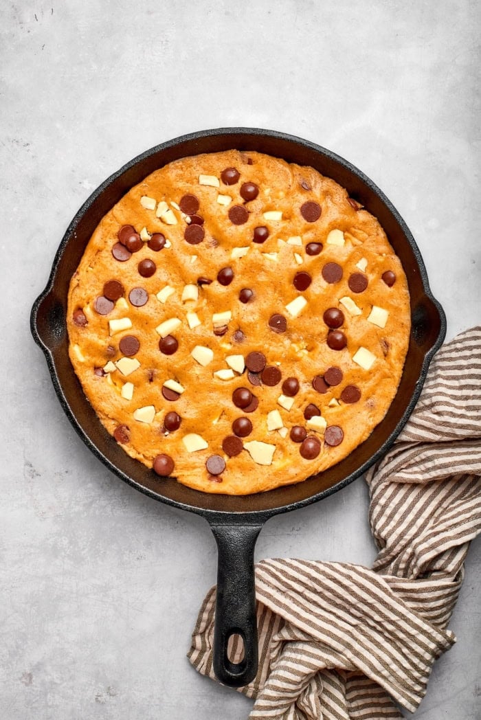 Brown butter chocolate chip skillet cookie in cast iron skillet.