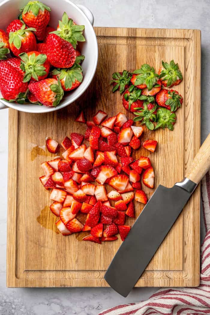 Overhead view of strawberries on cutting board