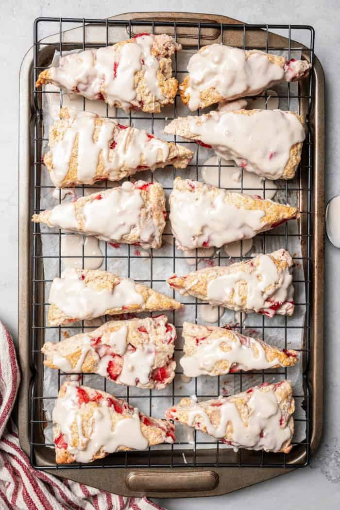 Overhead view of strawberry scones on wire rack
