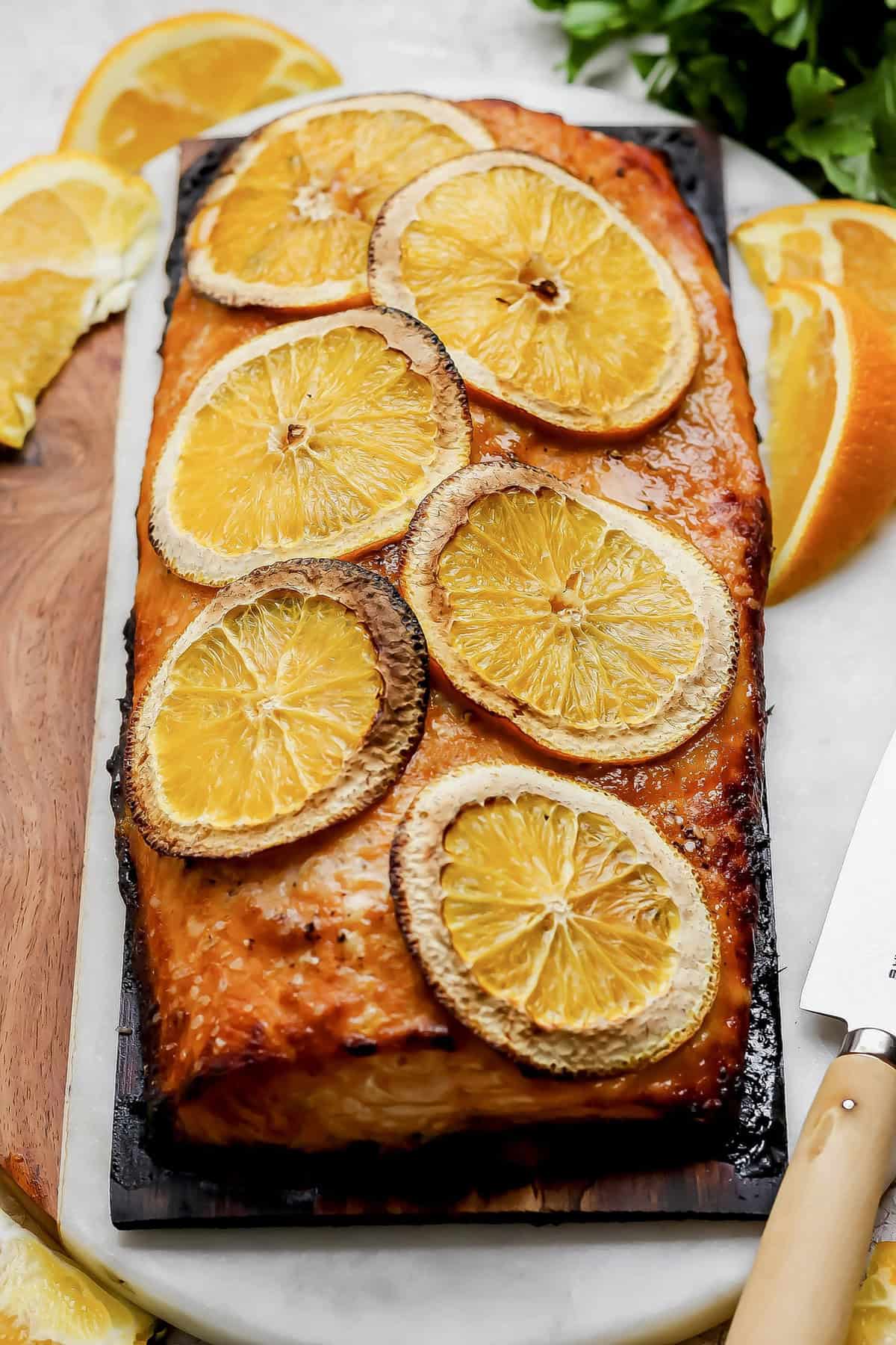Grilled Chipotle-Orange Salmon is sweet, smoky and just a bit spicy, with irresistible caramelized edges. An easy recipe that feels special! Grilled chipotle-orange salmon on cedar plank