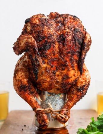 Cooked beer can chicken standing on can